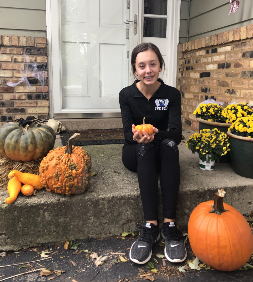 Freshman Jessica Jarosik posing with her Halloween Pumpkins